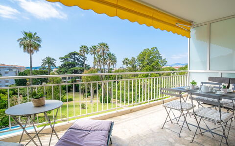 Les Pervenches: Sky, Plant, Property, Furniture, Shade, Building, Table, Outdoor Furniture, Tree, Interior Design