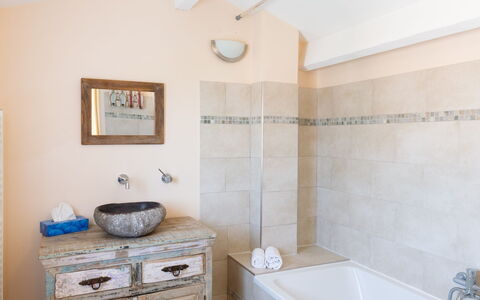 La Discrete: Bathtub, Building, Property, Plumbing Fixture, Bathroom Cabinet, Azure, Wood, Bathroom, Interior Design, Lighting