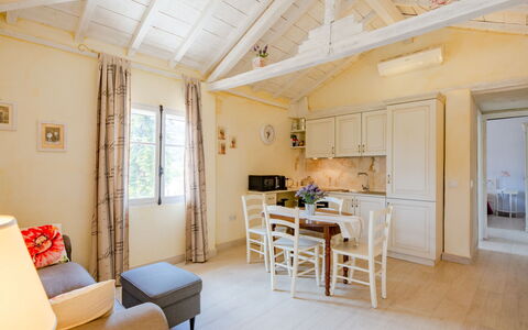 Elena: Table, Furniture, Water, Property, Sky, Building, Cloud, Chair, Outdoor Table, Outdoor Furniture