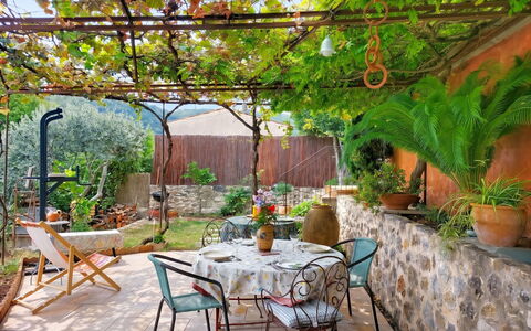 Maison de Village Manolsi: Furniture, Flowerpot, Outdoor Furniture, Garden, Chair, Shade, Flagstone, Outdoor Table, Backyard